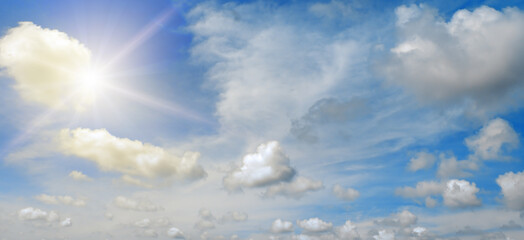 blue sky with white clouds and sun.