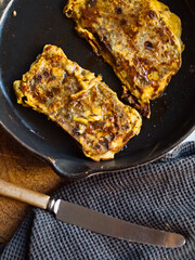 Rustic french toast in cast iron pan.