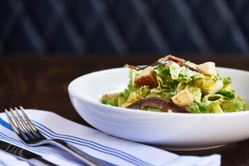 Elegant Caesar Salad on Restaurant Table