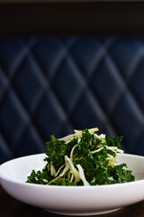 Kale Salad with Green Apple on Wooden Table