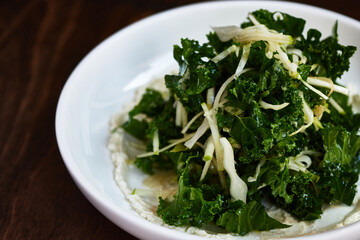 Kale Salad with Green Apple on Wooden Table