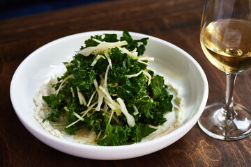 Kale Salad with Green Apple on Wooden Table