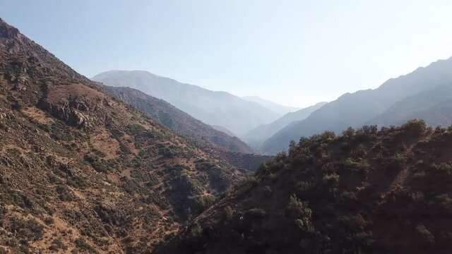 Donre shot above chilean valley in santiago de chile with a long view to the horizon threw high mountains