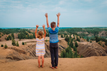 happy boy and girl travel in nature, kids looking at scenic landscape