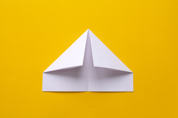 Fototapeta premium assembly procedure for a white paper ship. Origami.