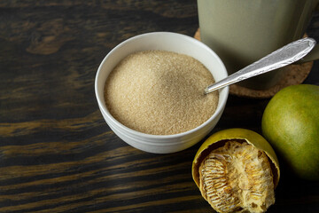 dried monk fruit, luo han guo, and monk fruit sugar crystals accompanied with a cup of tea or coffee