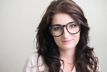 Obraz premium Portrait of young beautiful woman with brown hair