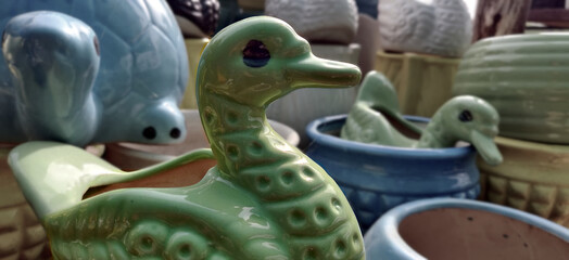 Green duck garden porcelain pot in a nursery for sale