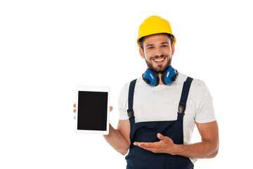 Smiling manual worker pointing with hand at digital tablet with blank screen isolated on white