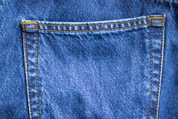 Blue jeans background texture. Denim back pocket.