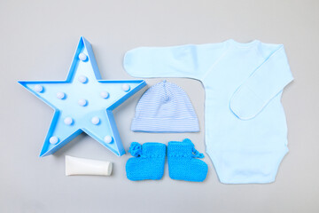 Baby concept. Baby cloth and goods on grey  background. Place for text. View from above. Flat Lay - Image