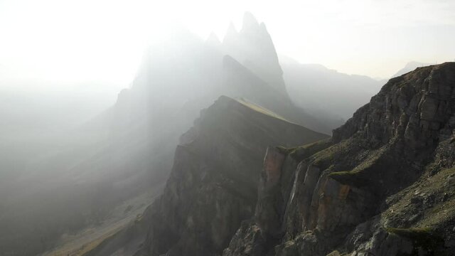 Aerial unveil shot of Seceda mountain in Puez-Geisler Nature Park, Dolomites Italy. Epic landscapes of South Tirol travel destination, European Alps wanderlust