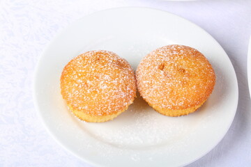 Cupcakes. Curd muffins on a white plate