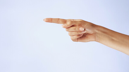 female hand shows on someone and calls to his gestures closeup isolated on white background