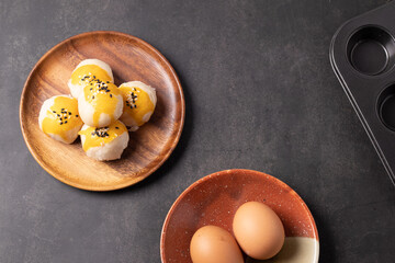 Chinese pastries and eggs on a black background