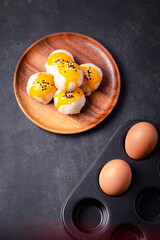 Chinese pastries and eggs on a black background