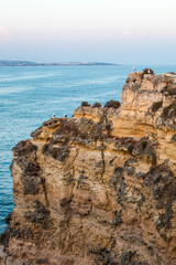Fototapeta na wymiar Algarve, Lisbon. Beautiful bay near Lagos town with high cliffs on the shore of the Atlantic Ocean. The Algarve is the southernmost region of continental Portugal. 