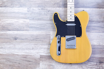 old electric guitar on wood background