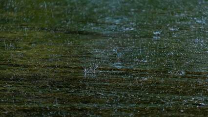 The background of water droplets splashed on the road surface
