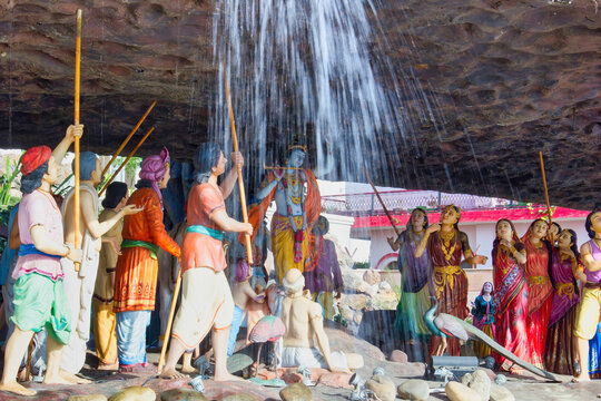 Mathura, India - April 11, 2014: Exterior of Prem Mandir (Love Temple) a Hindu temple in Vrindavan. Sculpture of Krishna God holding a mountain.