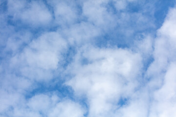 White clouds on a blue sky as background