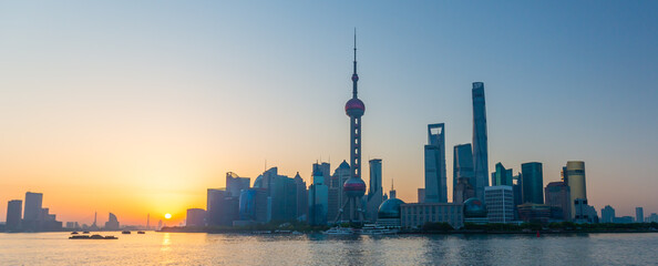 Sun rising over Shanghai - colorful dusk at the chinese metropolis.