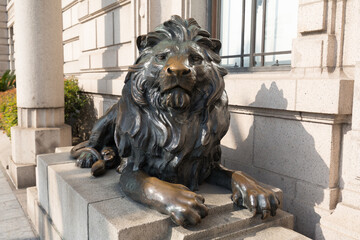 Lion sculpture guarding the entrance a building at the Bund
