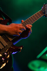 The guitar player in the middle of the show