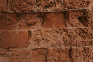 Stone wall texture/background,historical old ancient stone,preserved to our time, stones are laid evenly, solid construction has been standing for many centuries,ancient buildings,buildings and ruins