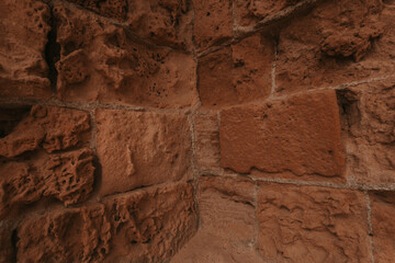 Stone wall texture/background,historical old ancient stone,preserved to our time, stones are laid evenly, solid construction has been standing for many centuries,ancient buildings,buildings and ruins