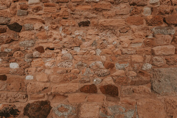 Stone wall texture/background,historical old ancient stone,preserved to our time, stones are laid evenly, solid construction has been standing for many centuries,ancient buildings,buildings and ruins
