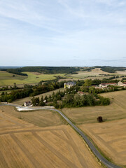 BORDEAUX, FRANCE - AUGUST 24 2018: Aerial view of french castle Chateau de La Cote in summer. Rural landscape, nature, green meadows fields trees around castle. Balcony, upstairs plants on the wall
