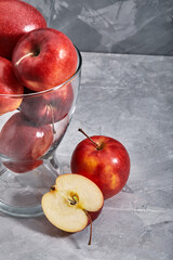 Red apples on the table. Top view with copy space on gray stone background.