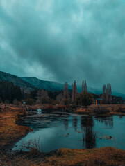 River at the foot of the hill