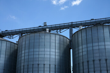 An old rusted silo photographed in a port area in summer