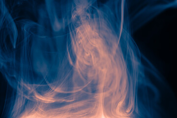 Clouds of colored flowing smoke on a dark background.
