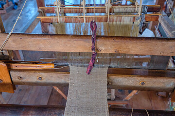 Myanmar, Inle lake: Loom at the silk factory.