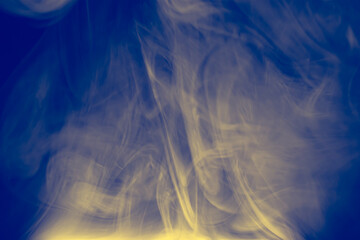 Clouds of colored flowing smoke on a dark background.