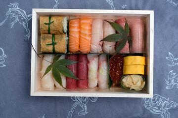 Luxury artisan Japanese bento box with salmon and tuna sushi, caviar and ginger