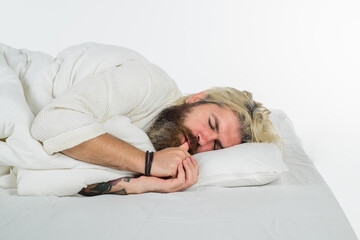 Sleep. Bearded man sleep in bed. Bearded man in bed. Morning and wake up. Man sleeping in bed at home. Man sleeping on white bed.