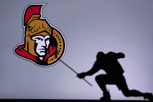 TORONTO, CANADA, 17. JULY: Ottawa Senators Logo. Professional NHL hockey player celebrate goal. Silhouette photo, Edit space
