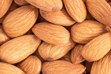 Almond background texture. Background of raw almond nut located randomly