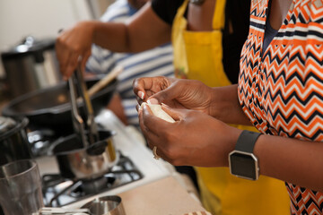 Women  cooking on stove top