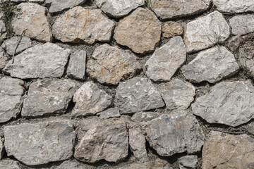 Ancient antique cracked masonry walls. Fortress wall