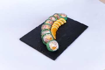 Sushi rolls on white plate japanese cuisine ginger
