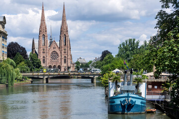 Fototapeta na wymiar View at the church of Saint Paul with river Ill in Strasbourg, France.