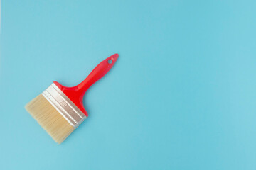 brush for painting on a blue background. Repair