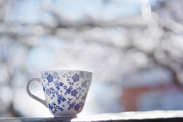 Obraz na płótnie Canvas A Cup of hot tea standing in the street.