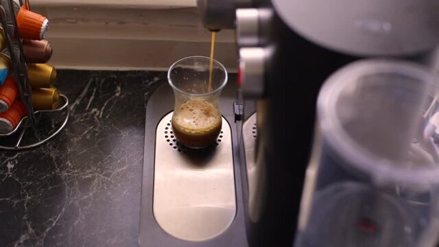 Espresso coffee being made in kitchen