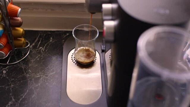Espresso coffee being made in kitchen